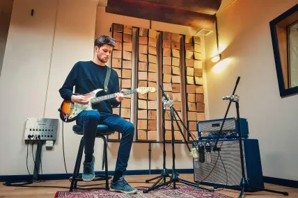 Guitarist and Fender amplifier
