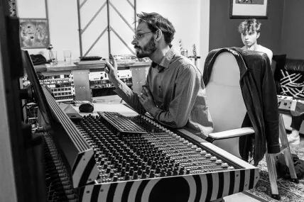 Dax producing an artist