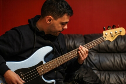 Bassist recording bass guitar